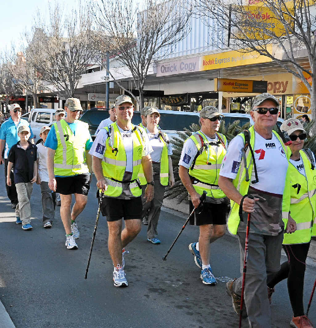 The walkers make their way down Palmerin St during the parade.